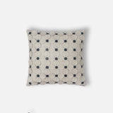 Floral leather cutwork cushion close up artisan detail - The Mage Home